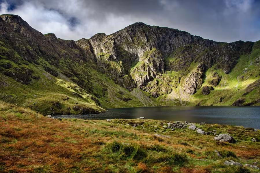 Llyn Cau glacial lake beneath the cliffs of Cadair Idris, Eryri National Park, near Tywyn, Wales