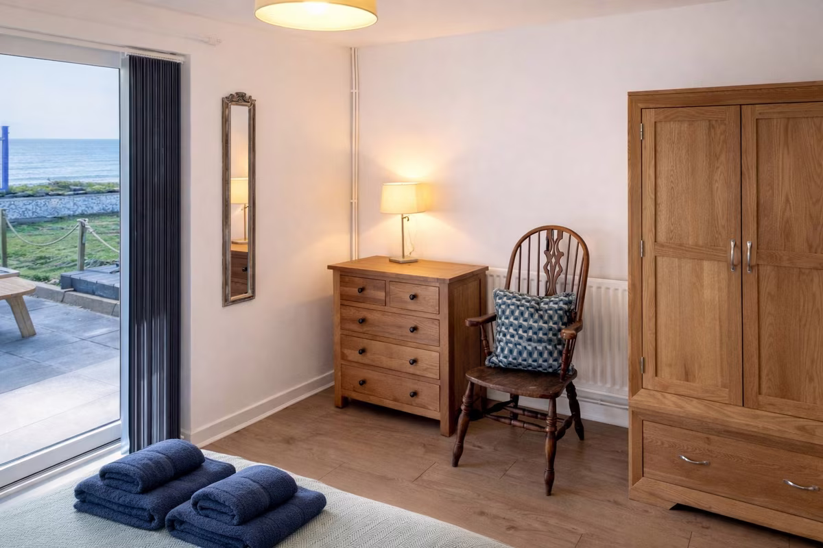 Venedotia – king bedroom with direct sea views and patio doors to the terrace